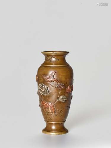 A SMALL MIXED METAL VASE WITH BIRDS AND FLOWERS