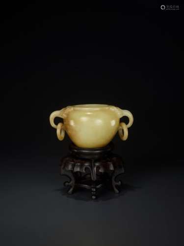 A QING DYNASTY YELLOW AND RUSSET JADE WATERPOT WITH TAO…