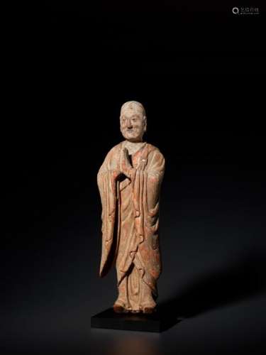 A CARVED WOOD AND GESSO FIGURE OF A LUOHAN, YUAN DYNAST…
