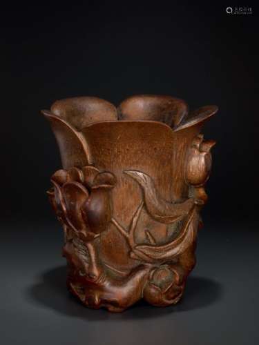A CARVED KANGXI PERIOD BAMBOO ‘MAGNOLIA’ LIBATION CUP