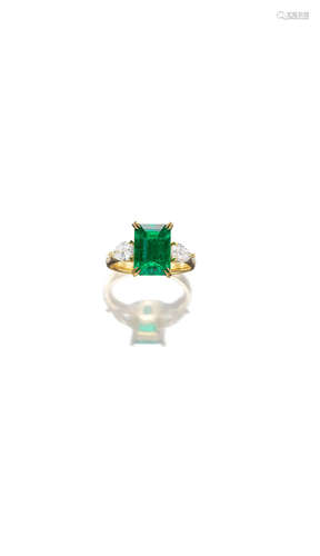 An Emerald and Diamond Ring