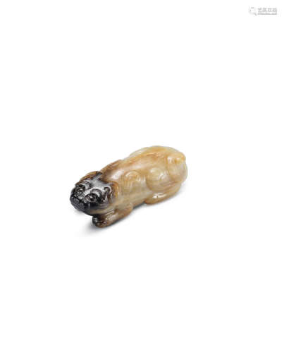 Song/Ming Dynasty A pale green, russet and black jade carving of a mythical beast
