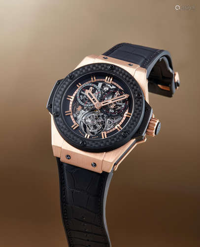 Hublot, An Extremely Rare Limited Edition King Gold Titanium and Carbon Fibre Skeletonised Minute Repeating Single Button Chronograph Tourbillon Wristwatch with Cathedral Gongs