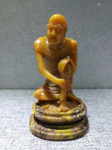 A TIANHUANG STONE CARVED LUOHAN FIGURE