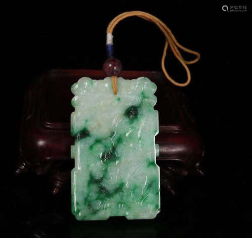 A JADEITE CARVED PENDANT