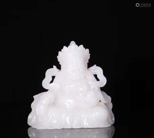 A HETIAN JADE CARVED BUDDHA FIGURE