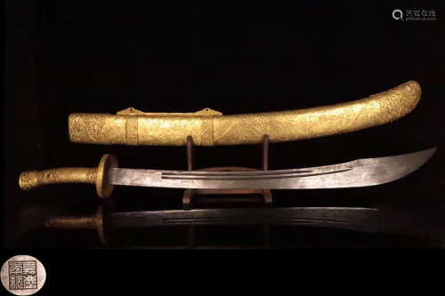 A GILT COPPER MOLDED TREASURED SWORD