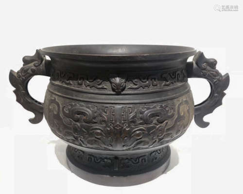 A COPPER MOLDED DOUBLE-EAR CENSER