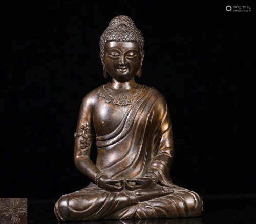 A BRONZE SAKYAMUNI FIGURE