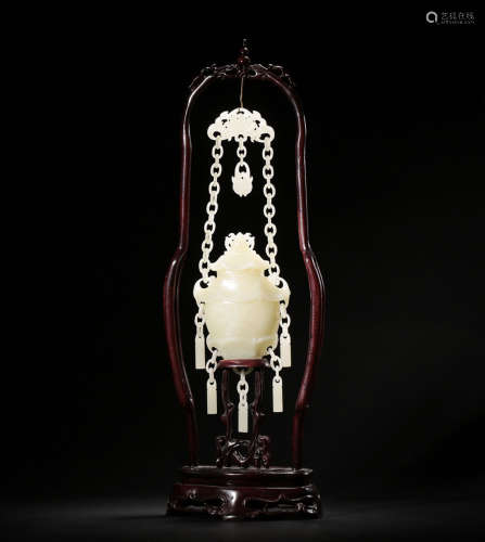 A HETIAN JADE VASE AND CHAIN WITH WOOD HOLDER