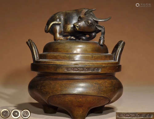 A BRONZE MOLDED TRIPOD CENSER