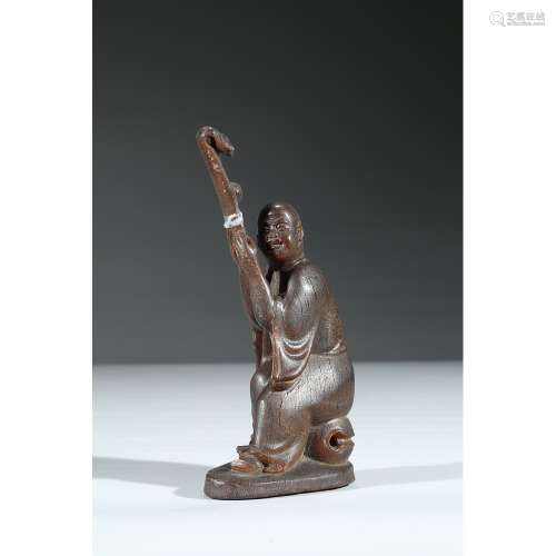 A CARVED HORN FIGURE OF MONK