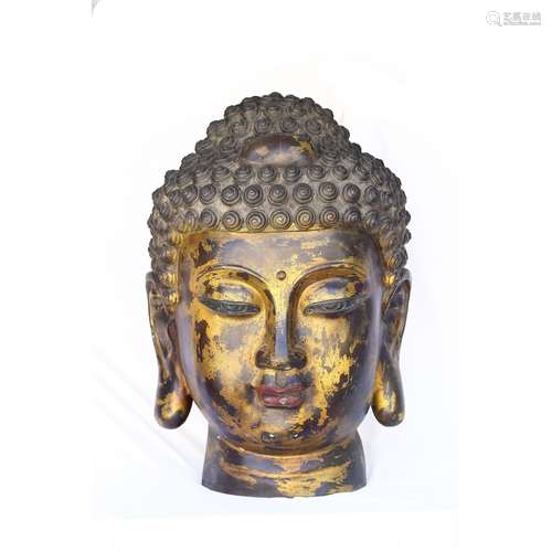 A LARGE GILT-BRONZE HEAD OF SHAKYAMUNI BUDDHA