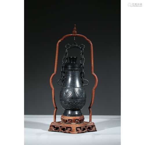 A BLACK JADE HANGING VASE AND COVER