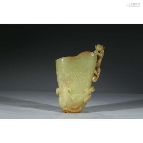 A CARVED YELLOW JADE 'DRAGON' LIBATION CUP