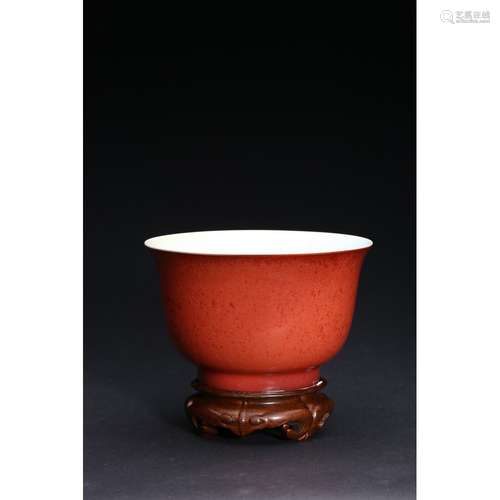 A CORAL-RED GLAZED BOWL