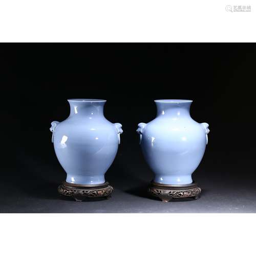 A PAIR OF BLUE-GLAZED MOULDED VASES