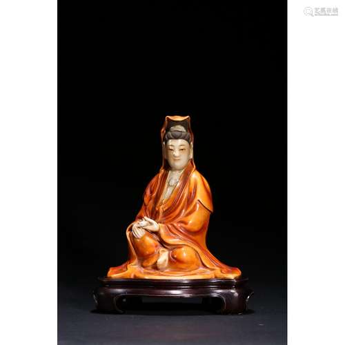 A CORAL-RED GLAZED FIGURE OF GUANYIN