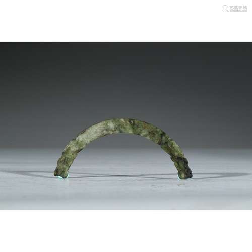 A CARVED GREYISH-GREEN JADE 'DRAGON' HUANG