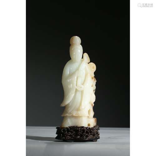 A WHITE JADE FIGURE OF GUANYIN