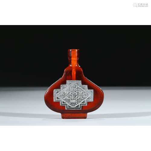 A RED GLASS SILVER INLAID SNUFF BOTTLE