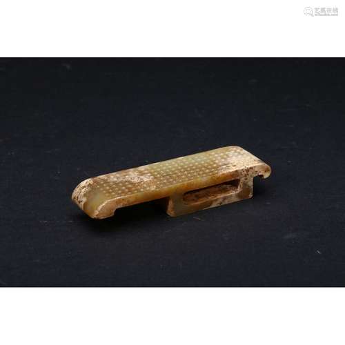 A CARVED JADE SWORD SLIDE