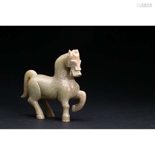 A CELADON JADE FIGURE OF A HORSE