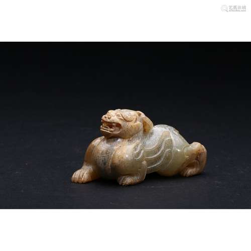 AN ARCHAIC JADE FIGURE OF A QILIN