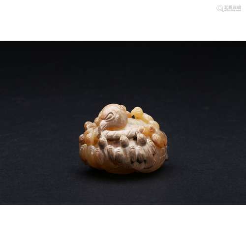 AN ARCHAIC JADE 'MAGPIES' CARVING