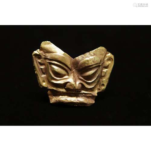 A RARE GOLD FIGURE MASK