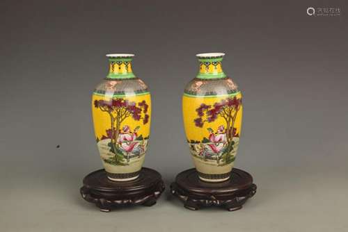 PAIR OF YELLOW GROUND STORY PAINTED PORCELAIN VASE