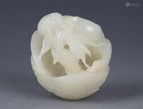 A FINE HETIAN WHITE JADE IN FIGURE OF LOTUS