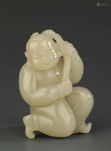 A FINE HETIAN JADE PENDANT IN FIGURE OF BOY PLAYING