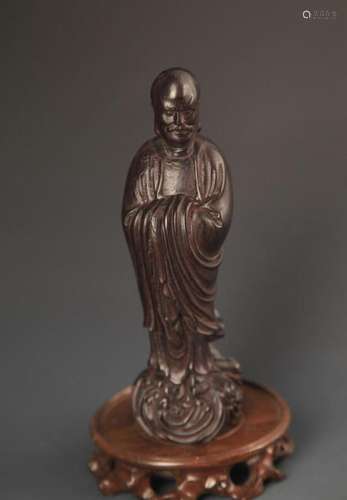 A FINE BLACK HARDWOOD STATUE IN FIGURE OF BODHIDHARMA