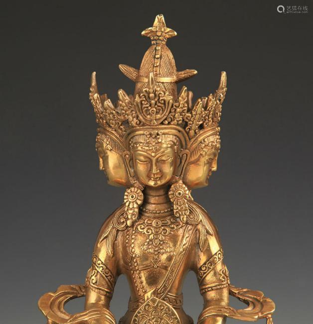 A TIBETAN BUDDHIST BRONZE ADJOIN 