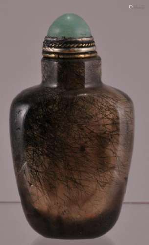 Hardstone snuff bottle. China. 19th century. Well hollowed rutilated quartz.  2-3/8