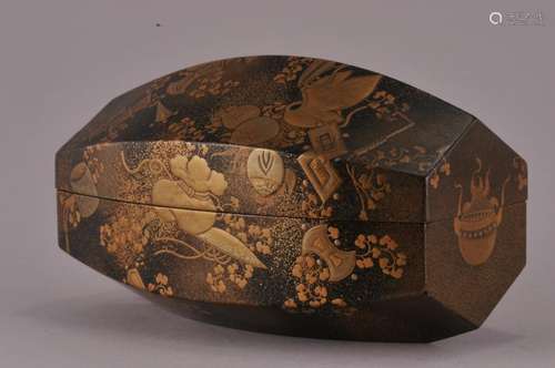 Lacquer box.  Japan. 19th century. Garden seat, octagonal shape. Gold lacquered decoration of auspicious emblems on a togidashi ground. 4-5/8