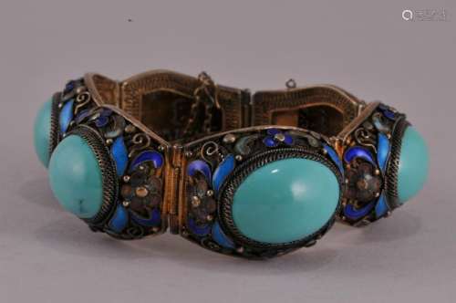 Late 19th century Chinese Enameled filigree silver bracelet mounted with four turquoise stone cabuchons. Enamel floral decoration. Marked silver on clasp.