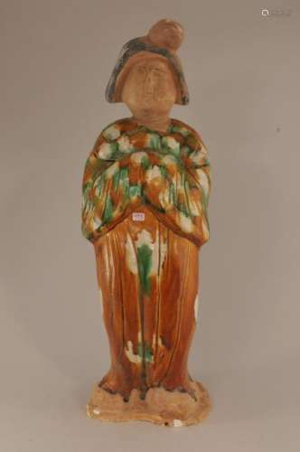 Pottery tomb figure. China. 20th century. San Tsai decorated court lady with a rabbit. Damage to the base. 16-1/2