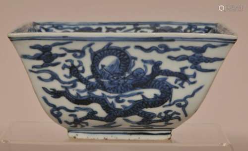 Porcelain measure. China. Ming period. Chia Ching period mark on the base. Underglaze decoration of dragons and clouds. Interior wit hju-I and a shou character.  6-1/2