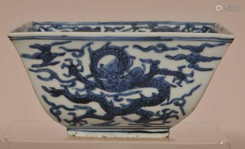 Porcelain measure. China. Ming period. Chia Ching period mark on the base. Underglaze decoration of dragons and clouds. Interior wit hju-I and a shou character.  6-1/2