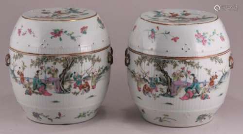 Pair of late Quing Dynasty Chinese porcelain barrel form covered jars. Ribbed bodies with Famille Rose figures in landscape decoration. Lug handles. 8