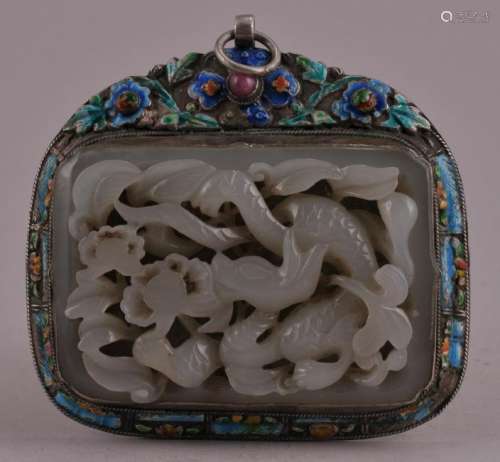 Pendant. China. Yuan period. (1279-1368). Belt plaque carved and pierced with a dragon and flowers. Silver mounts enameled and set with a ruby cabuchon.   Plaque- 2-3/4