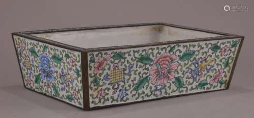 Canton enamel planter. China. 19th century. Decoration of floral scrolling and the eight precious emblems on a white ground. 5 