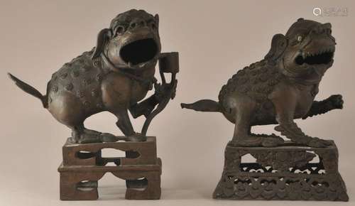 Pair of bronze Foo dogs. Tibet. 19th century. Ornately pierced cast base. Turquoise inlay.  Total height- 7