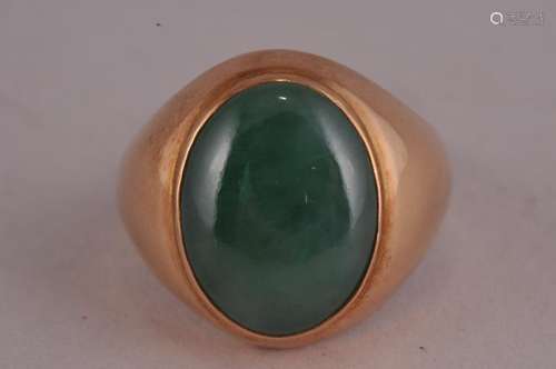 14 kt gold Chinese Green Jadeite large oval ring. Marked 14 kt and makers hallmark. Stone- 11/16