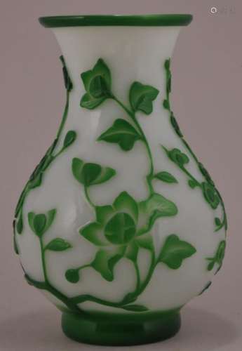 Peking Glass vase.  China. Circa 1920.  Marked CHINA. Pear shaped. Decoration of birds and flowering trees in green cut to white. 7-1/4