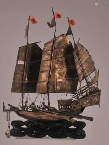 Silver junk. China. Late 19th century to early 20th century. Chinese Export. Wave carved blackwood base.   Ship only- 8