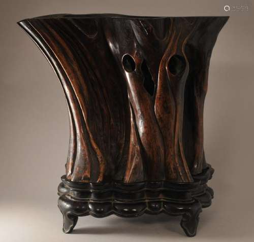 Scroll pot and stand. China. 18th century. Polished natural cypress trunk lightly carved. Fitted hardwood stand. 17-1/2