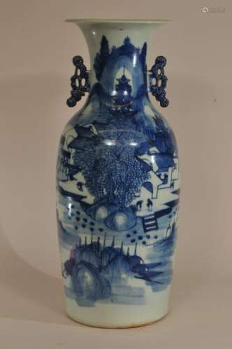 Porcelain vase.  China. Early 20th century. Baluster form with floral handles. Underglaze blue decoration of a landscape. 22